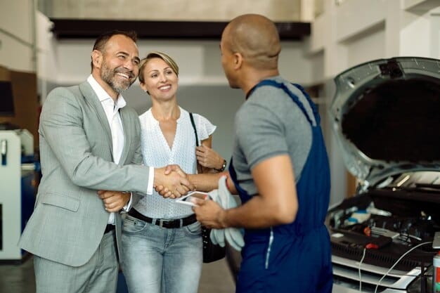 Customer discussing vehicle maintenance with a professional